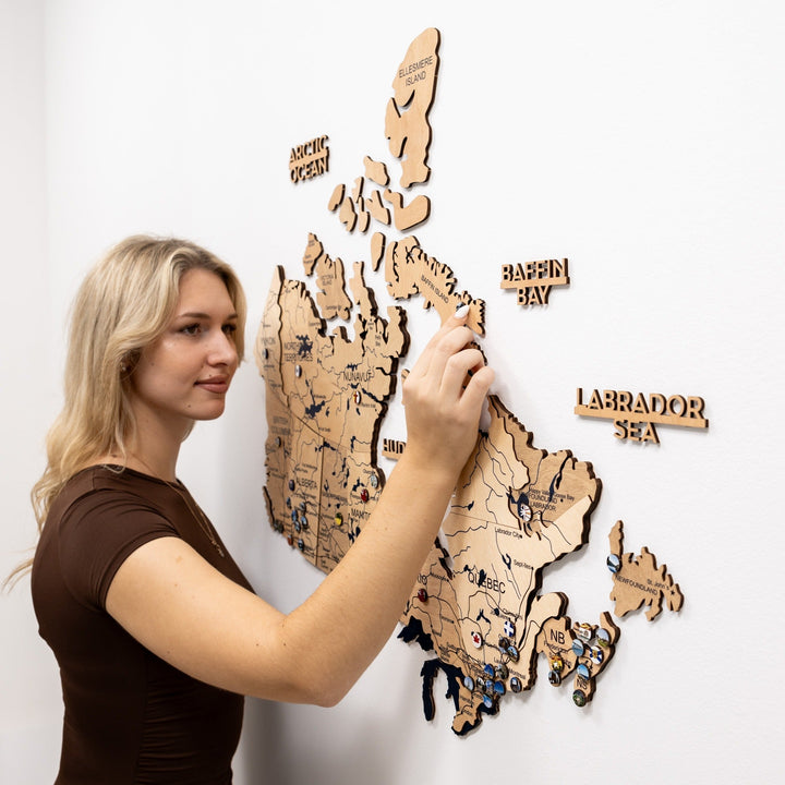 Wooden 3D Canada wall map with blue route lines and inset pins in northern regions