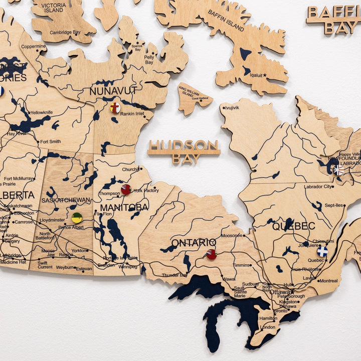 Close-up of wooden 3D Canada map showing Quebec, Ontario, Manitoba, and Hudson Bay
