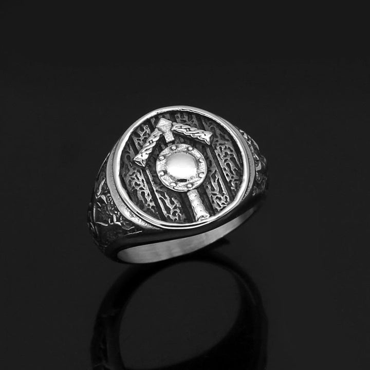 Stainless steel Tiwaz rune signet ring shown from top, oval crest and textured detailing