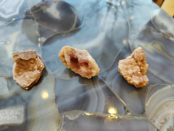 Amethyst crystal specimen set of three small rough clusters with pink-tinted interiors