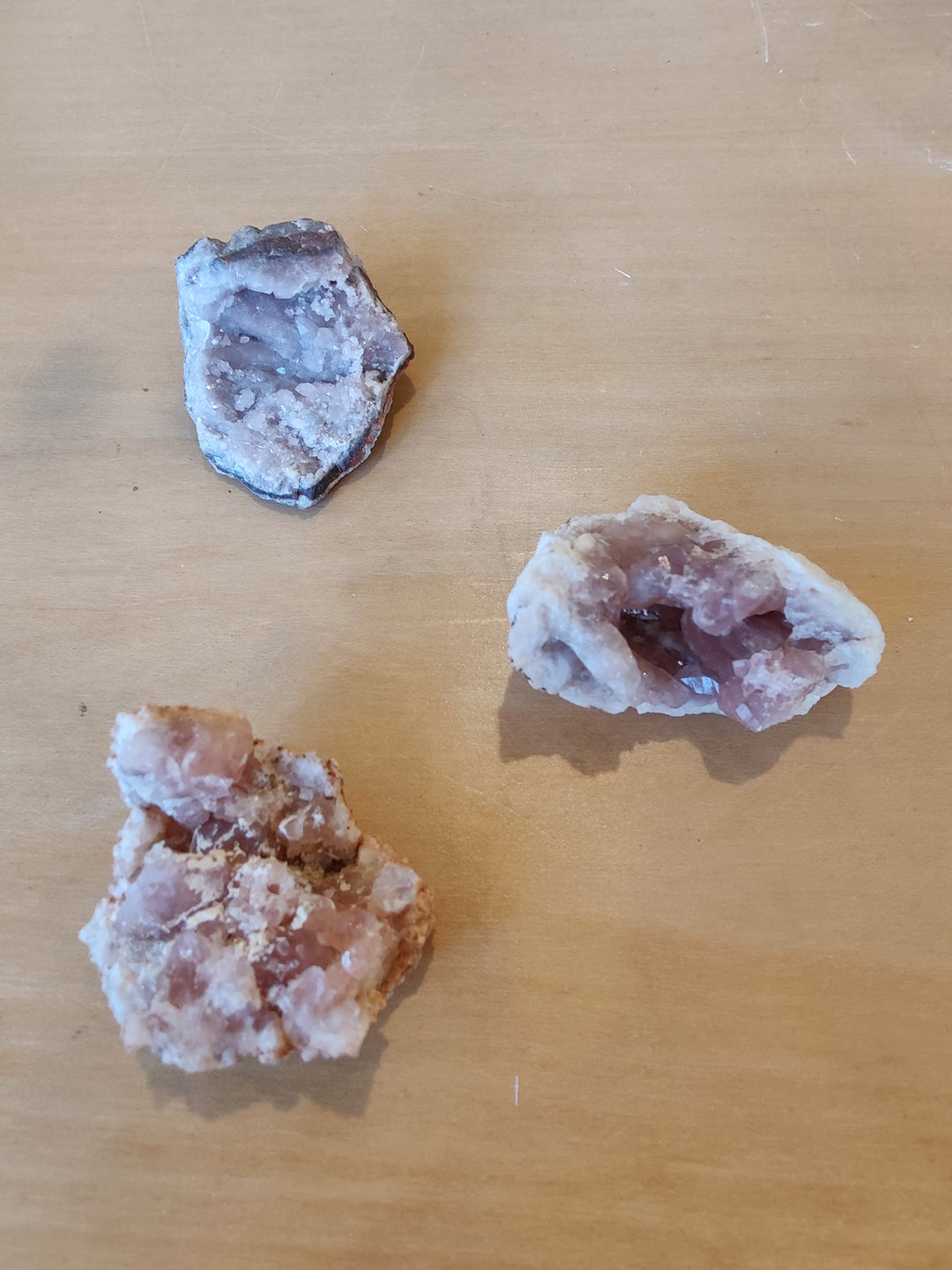 Pink amethyst crystal specimen set of three rough clusters with purple and pink tones