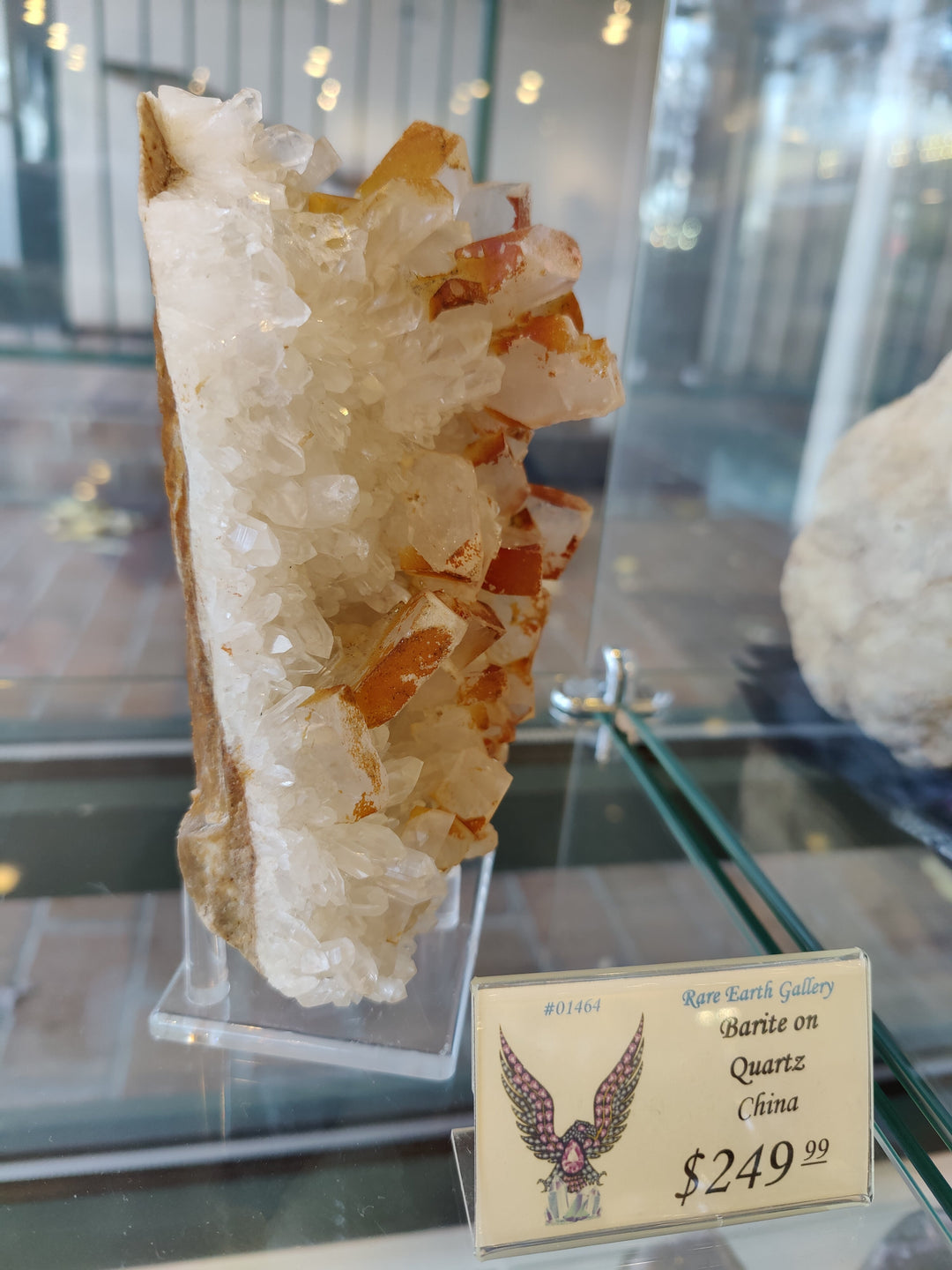 Orange barite and white quartz crystal specimen with small display card