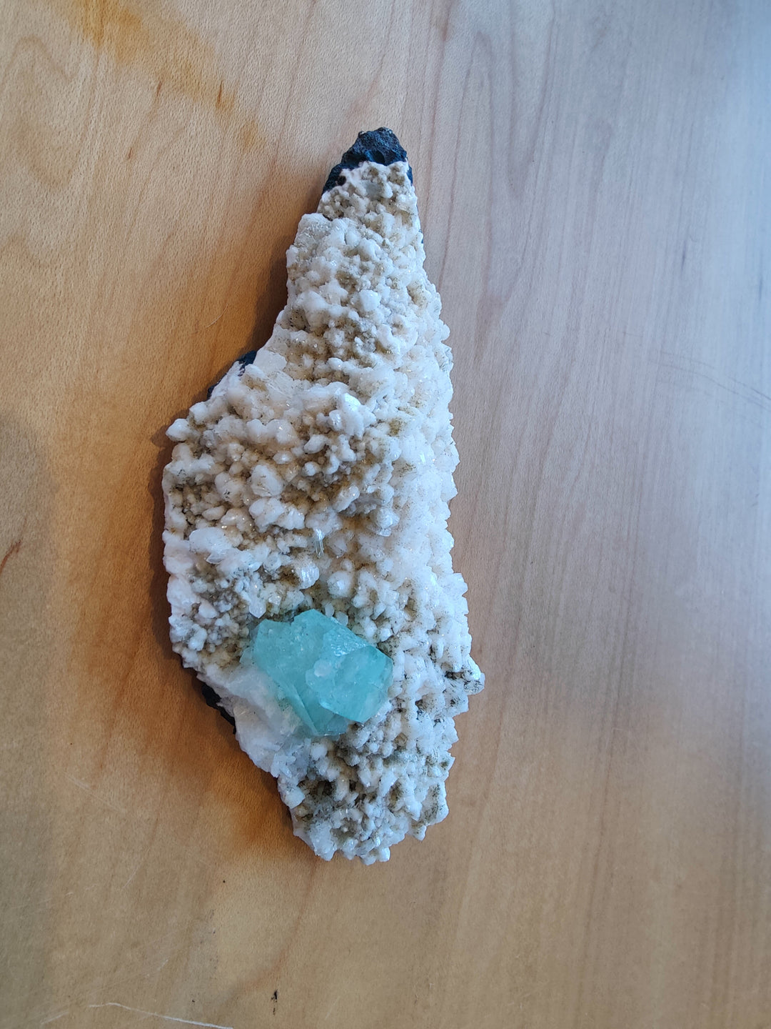 Mineral cluster with white druzy, light teal crystal, and green apophyllite