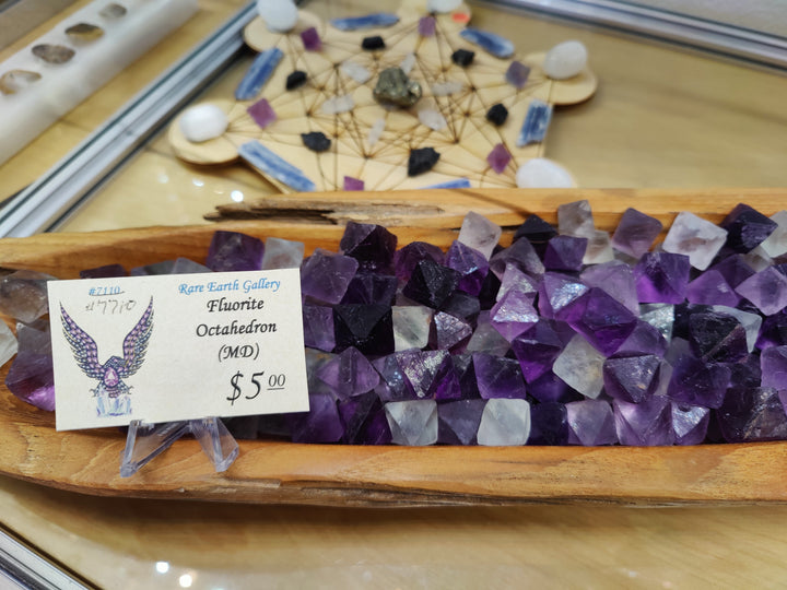 Purple fluorite octahedron crystal cluster in wooden tray with price tag