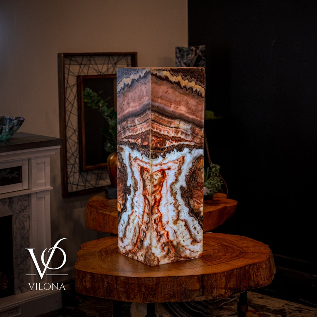 Small square floor lamp with multi-color agate-pattern shade, full view on wood surface