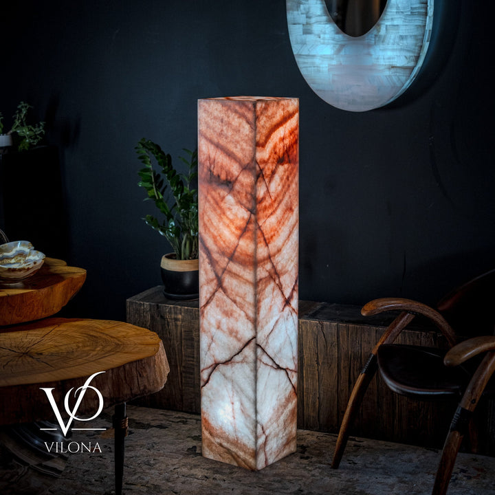 Square onyx-look floor lamp with orange top and white base with dark veins