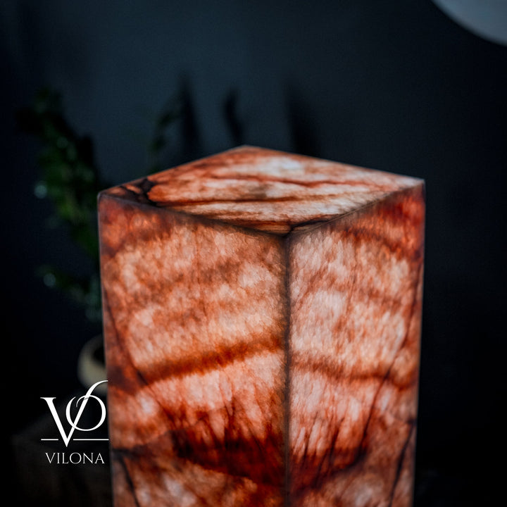 Square marble-pattern floor lamp top close-up with red and white mottled blocks