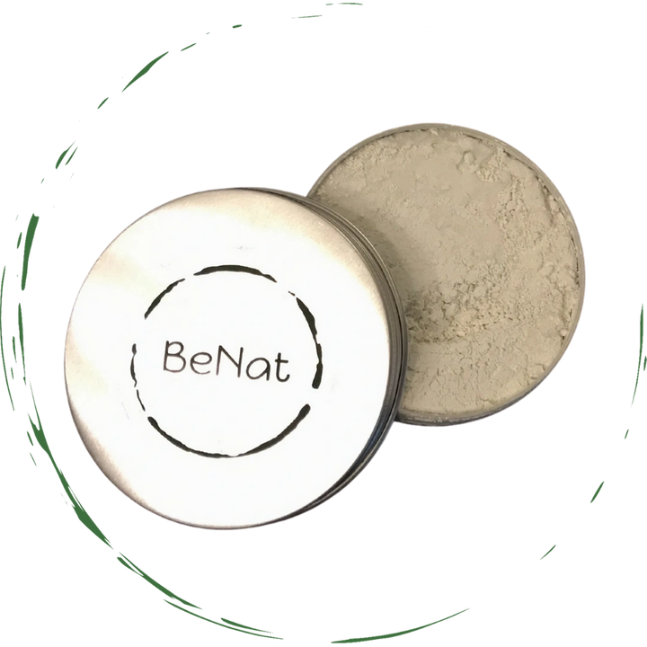 Open tooth powder tin with beige powder and matching round lid