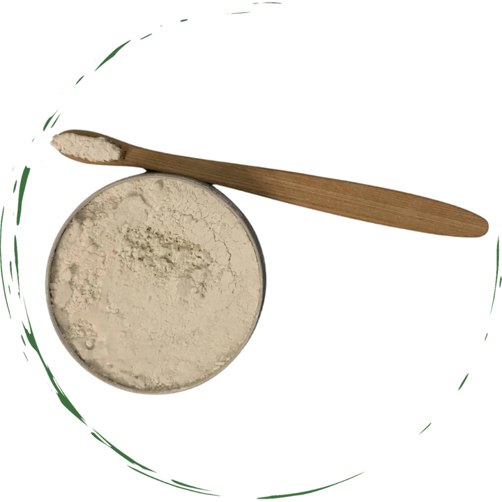 Tooth powder tin with pale beige powder and wooden scoop on top