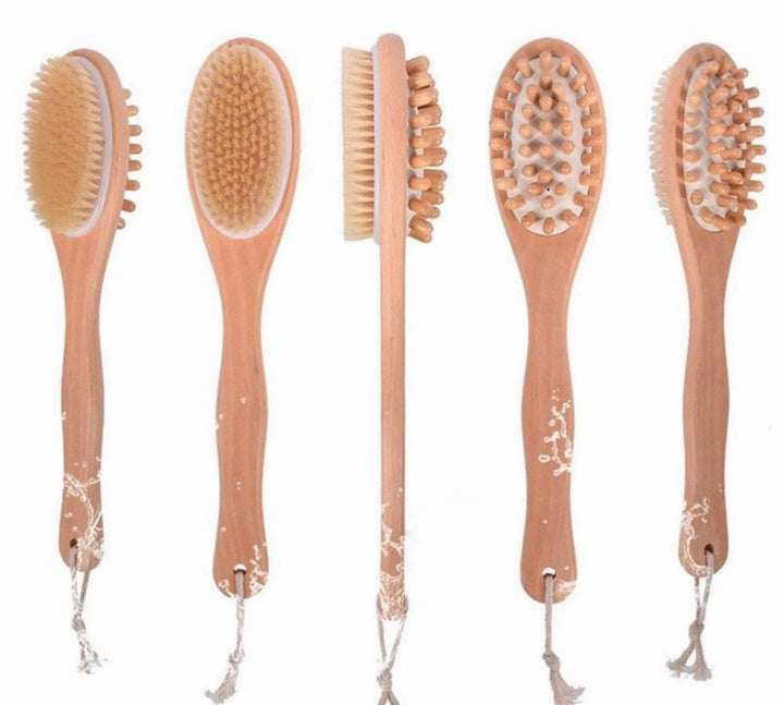 Set of bath and body massage brush heads on long wooden handles, different bristle styles