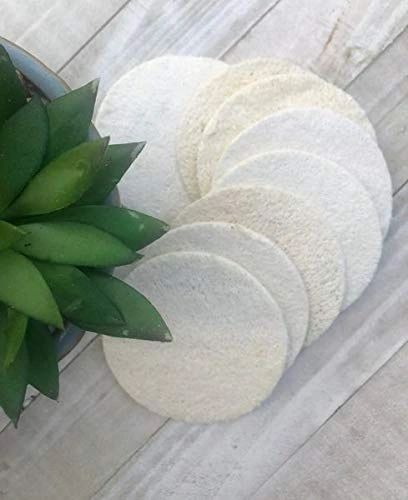 Stack of white facial cleansing pads with circular design