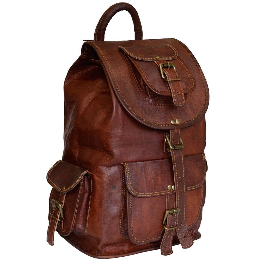 Brown leather backpack with flap top, front pouch and multiple side buckles.