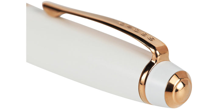 Pearlescent white ballpoint pen end with rose-gold trim and click mechanism