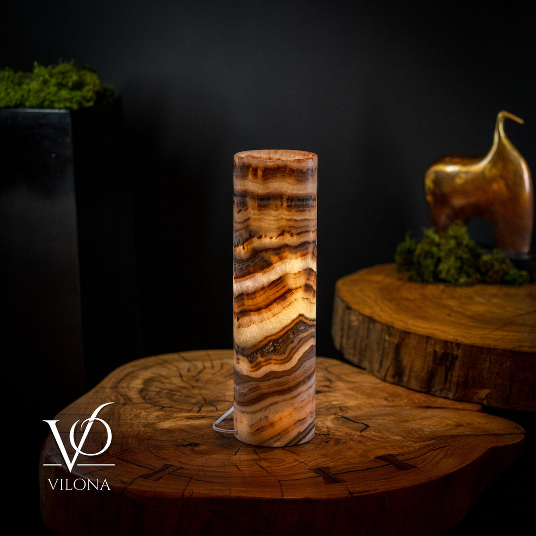 Cylindrical onyx crystal table lamp with amber-and-cream stone striations