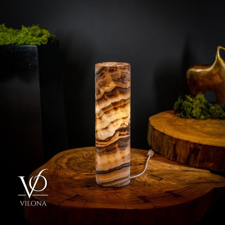 Sahara onyx cylinder table lamp with warm tan and dark brown swirls, white cord