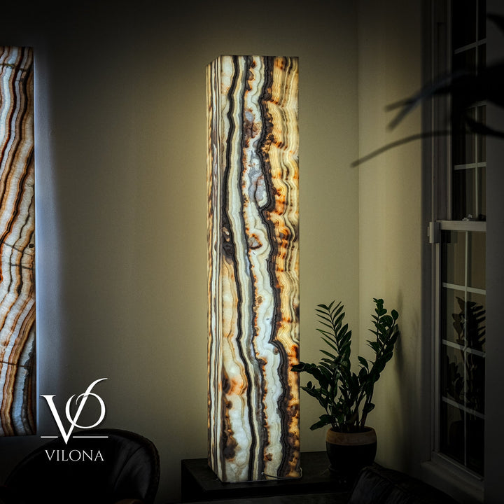 Floor lamp with tall square onyx shade, vertical cream and blue veins with amber highlights.