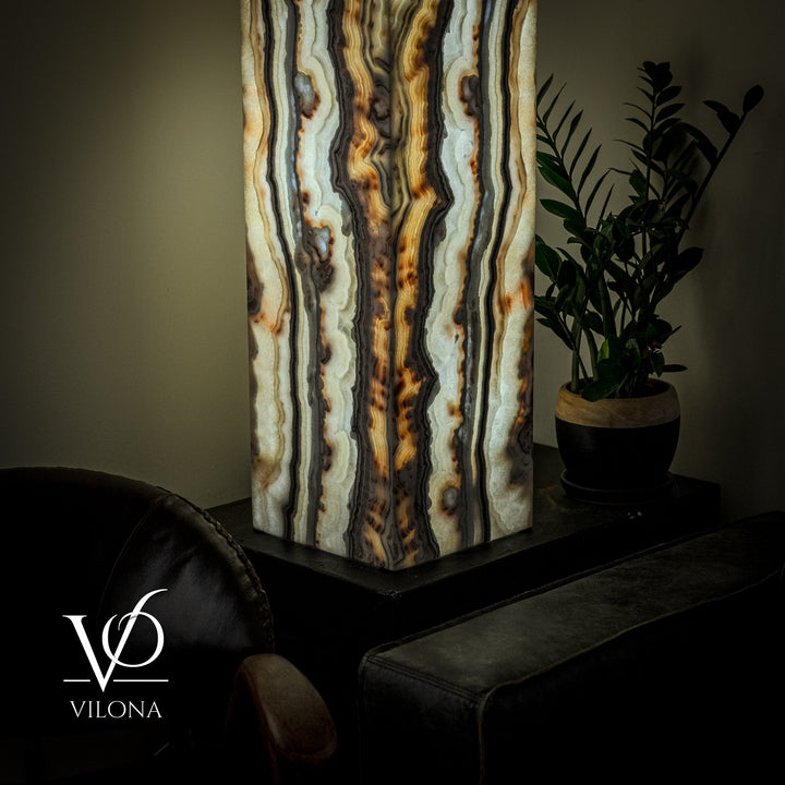 Floor lamp with tall square onyx shade, vertical cream, blue, and gold-brown patterns.