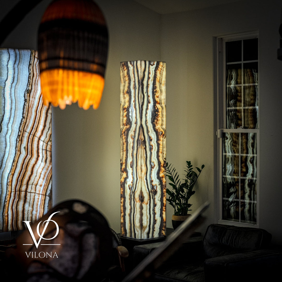 Illuminated floor lamp with tall square onyx shade, vertical cream-blue and amber veining.