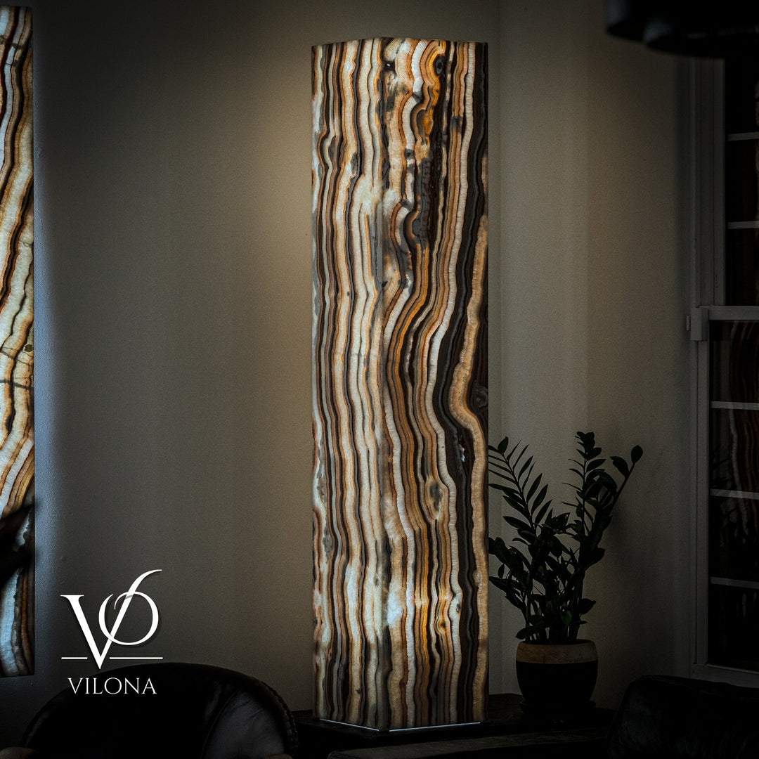 Tall rectangular onyx floor lamp shade with vertical wavy bands in cream, amber, and dark
