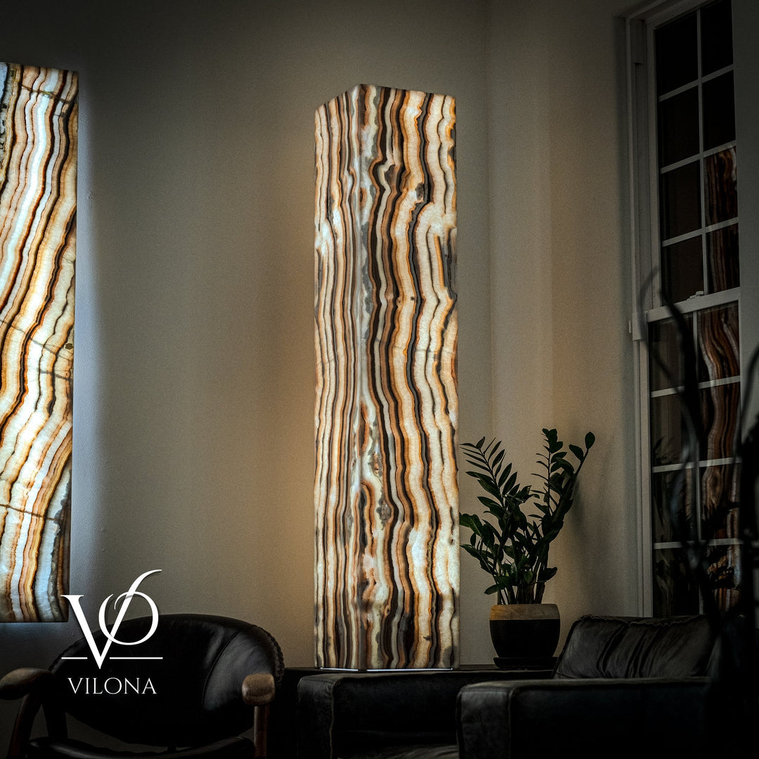 Onyx floor lamp shade with vertical wavy stripes in cream, amber, and dark gray tones