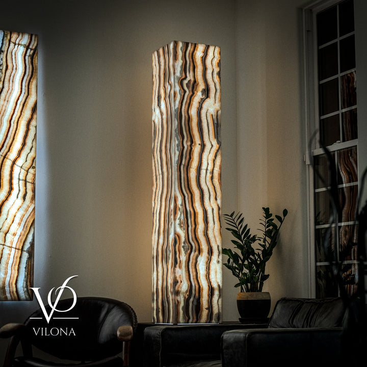 Onyx floor lamp shade with vertical wavy stripes in cream, amber, and dark gray tones