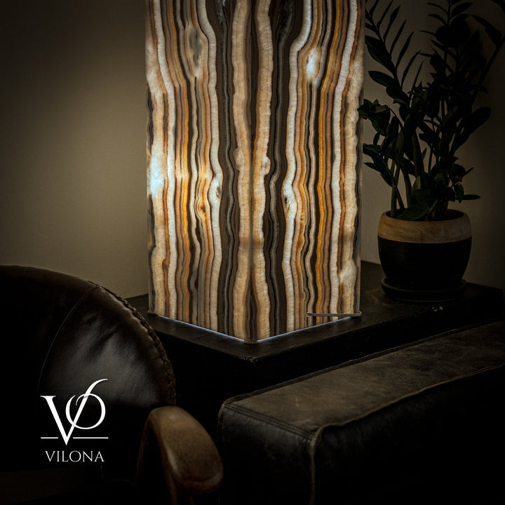 Large floor lamp with square black base and vertical striped fabric shade