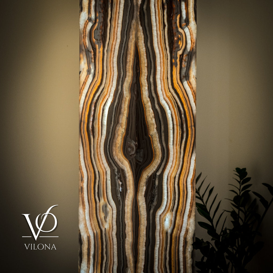 Onyx floor lamp shade close-up with glossy cream, amber, and dark wavy striping