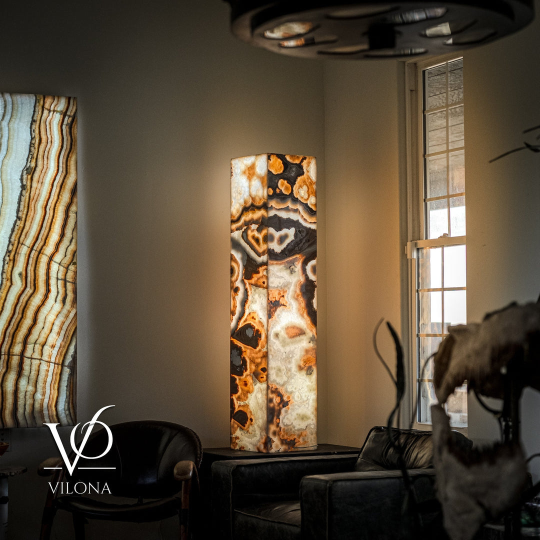 Polished onyx floor lamp with cream, black, and amber rectangular stone column and dark shade