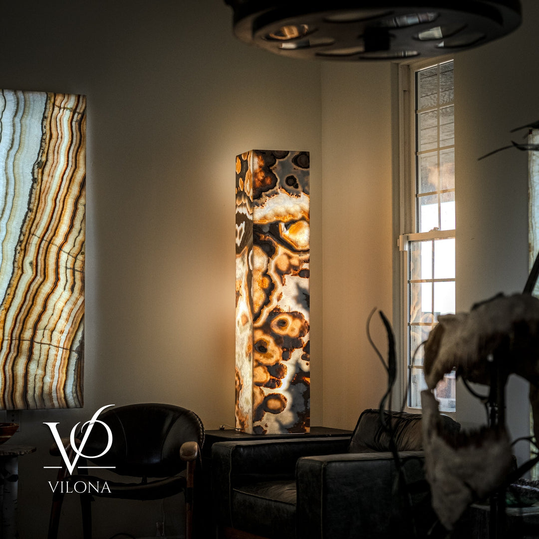 Polished onyx floor lamp with tall rectangular stone column and dark circular top shade