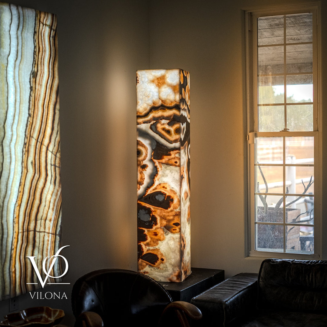 Polished onyx floor lamp with tall rectangular stone column and dark circular top shade