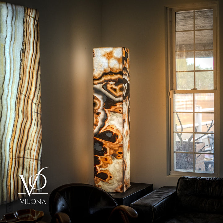 Polished onyx floor lamp with tall rectangular stone column and dark circular top shade