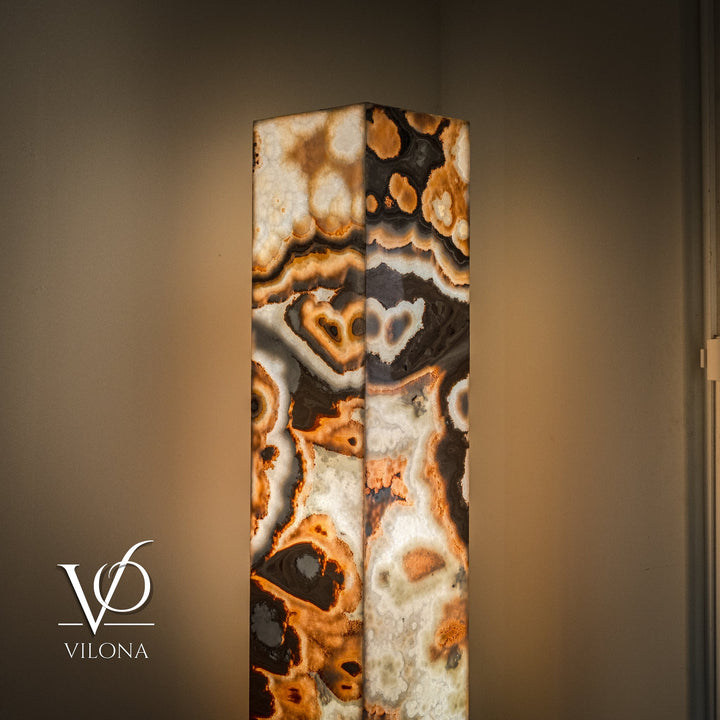 Polished onyx floor lamp stone column with cream and black striations and warm amber flecks