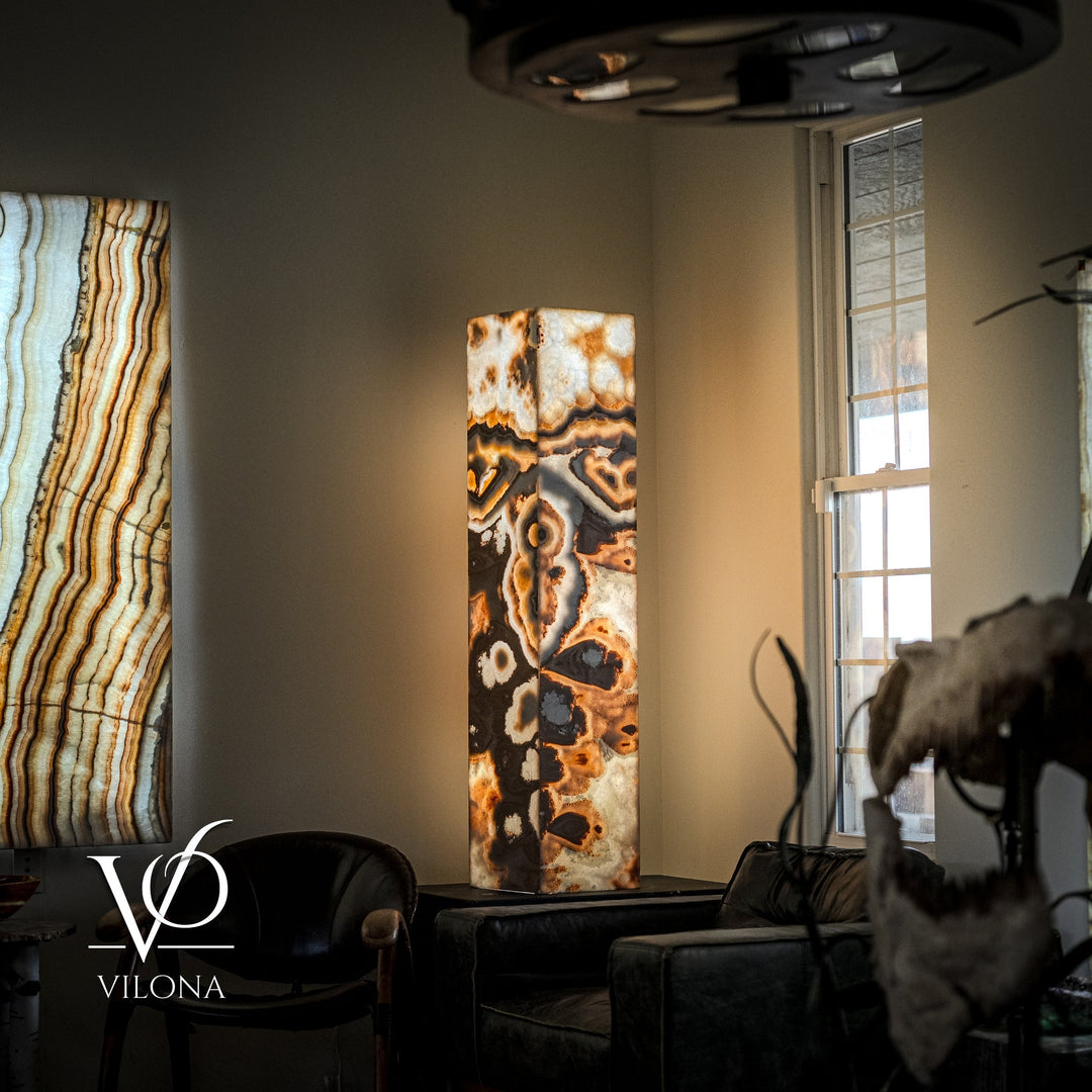 Polished onyx floor lamp with orange, black, and cream rectangular stone column and dark shade