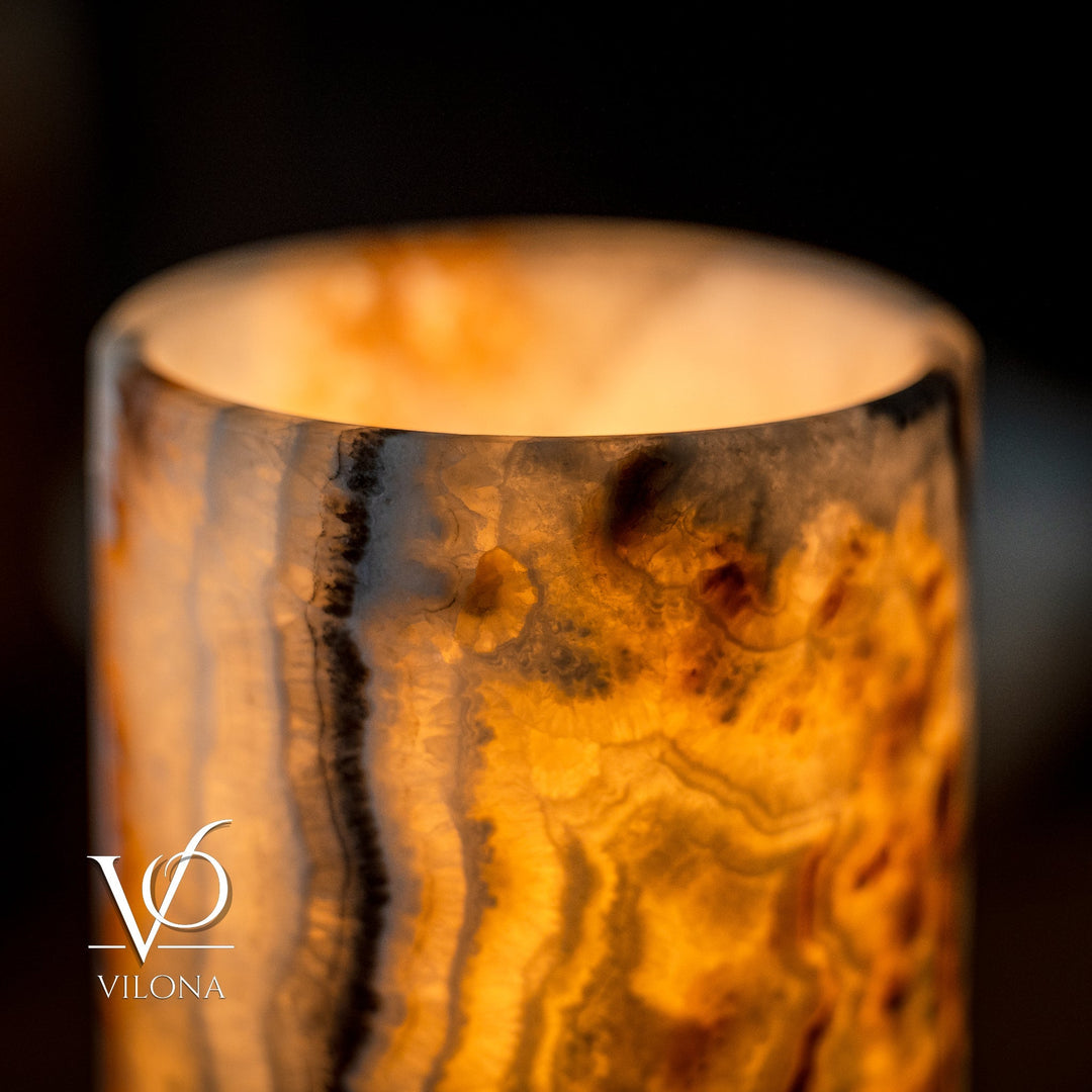 Cylindrical table lamp with amber onyx shade and open top close-up