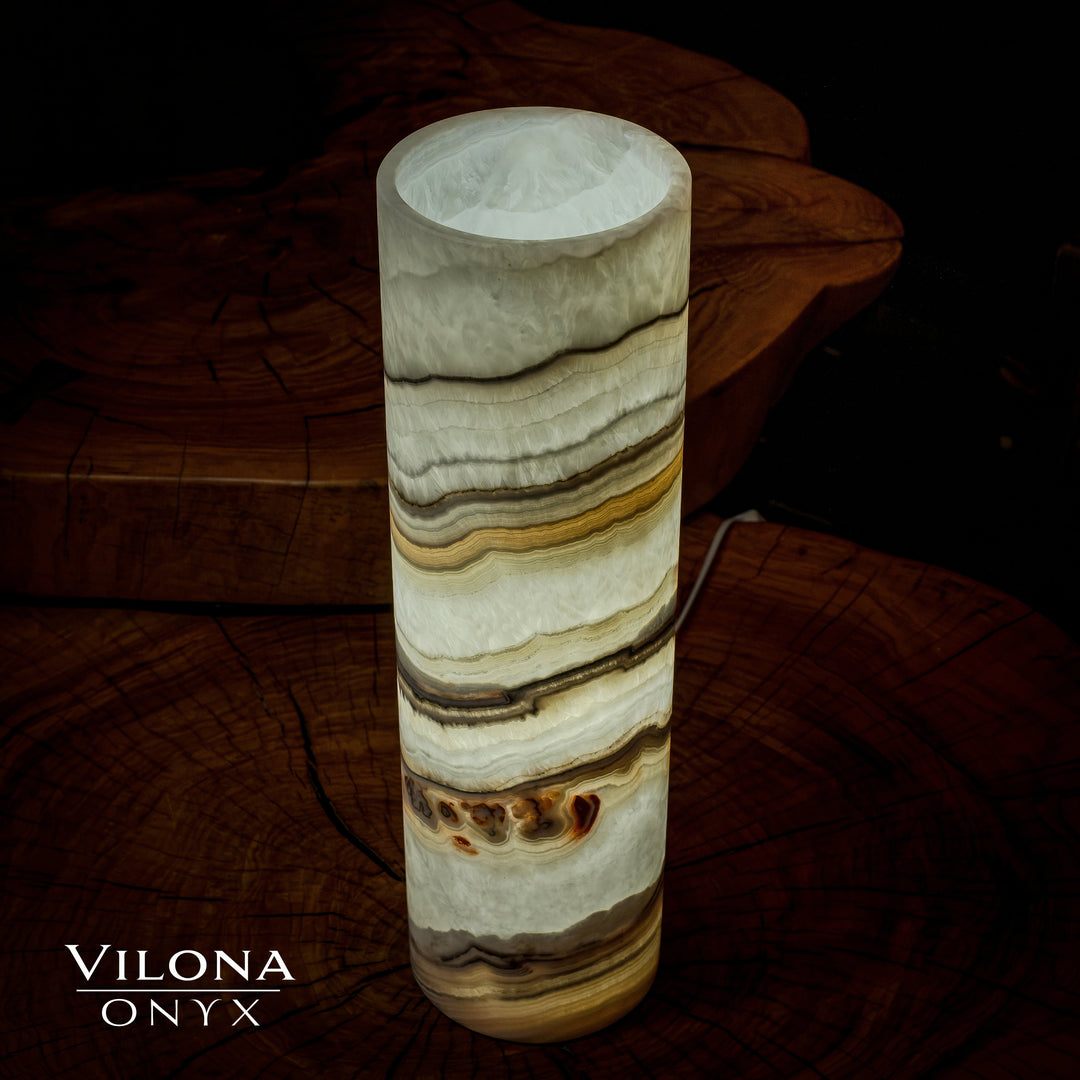 Onyx cylinder table lamp with cream stone shade and gold-brown and dark horizontal veining