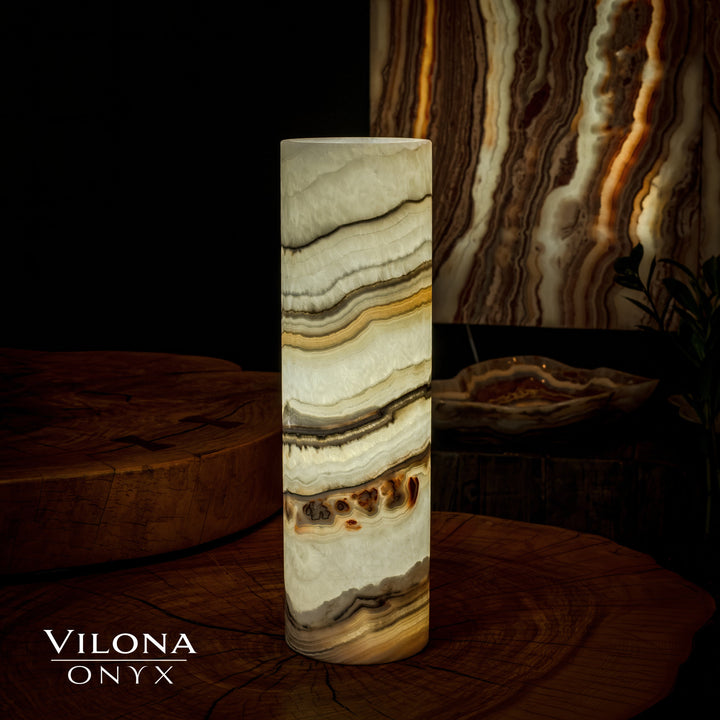 Flat-topped onyx cylinder table lamp with cream, tan, and dark banded stone pattern