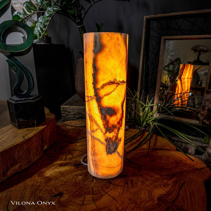 Cylinder table lamp with bright amber onyx-look cylinder shade, warm glow