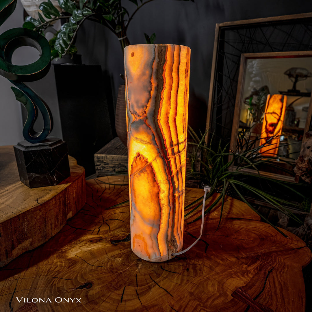 Cylinder table lamp with glowing amber onyx-look cylinder and vertical streaks