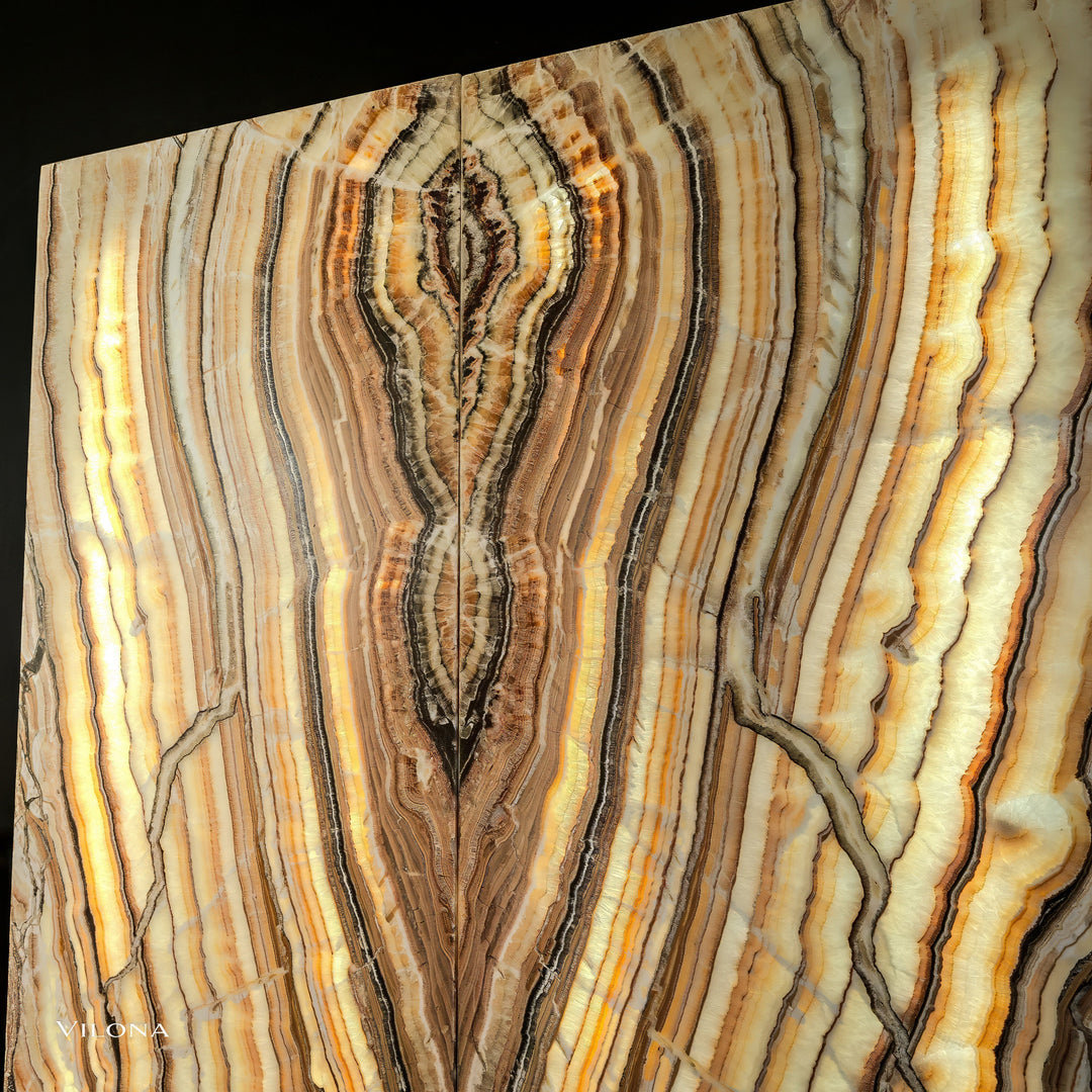 Onyx wall panel with arched veining, cream and golden bands, dark brown centers
