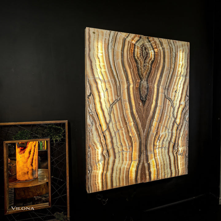 Onyx wall panel with arched golden-and-cream striations and dark accents
