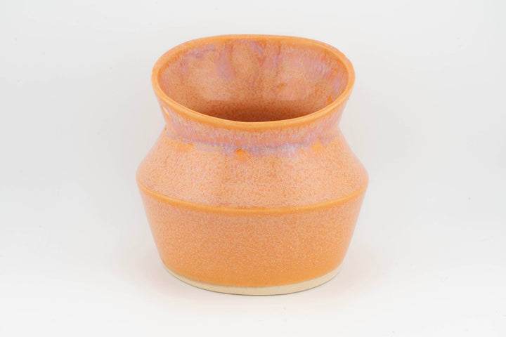 Ceramic dried flower sconce with side cutout, solid orange glaze with speckled texture