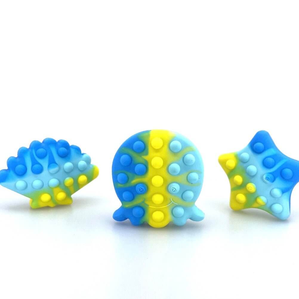 Three silicone sea animal fidget bath toys in blue and yellow with raised bubble dots