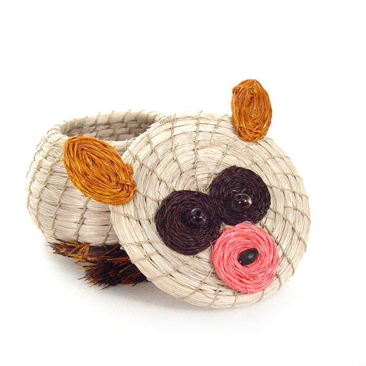 Woven bear-shaped basket with beige body, orange paws, black ears, and pink nose.