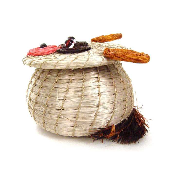 Bear-shaped woven basket, beige weave with orange arms and black tufted side.