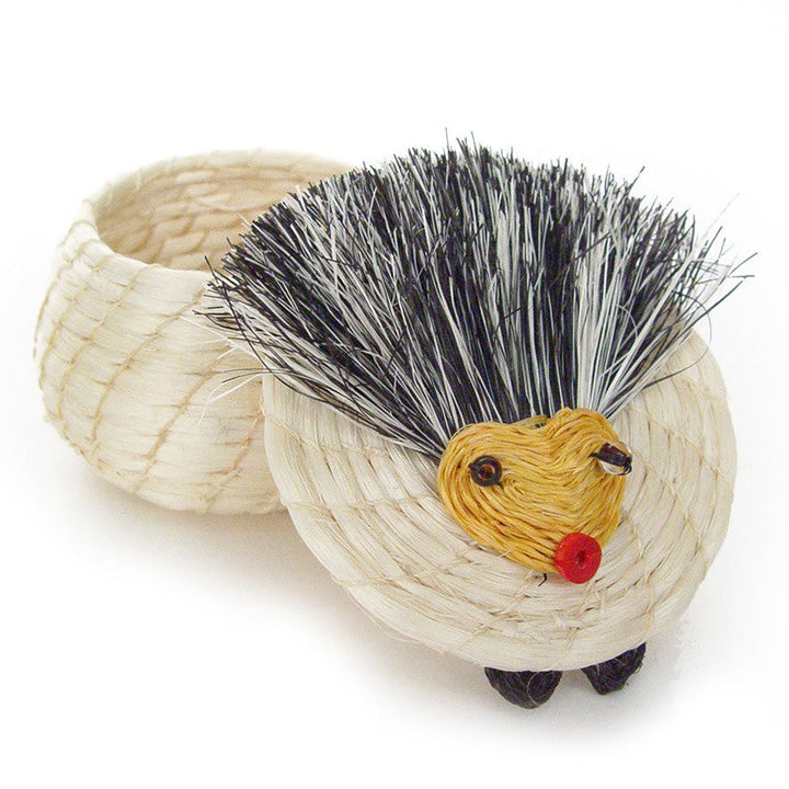 Hedgehog basket, side view: straw weave body, black bristles, yellow face, red nose