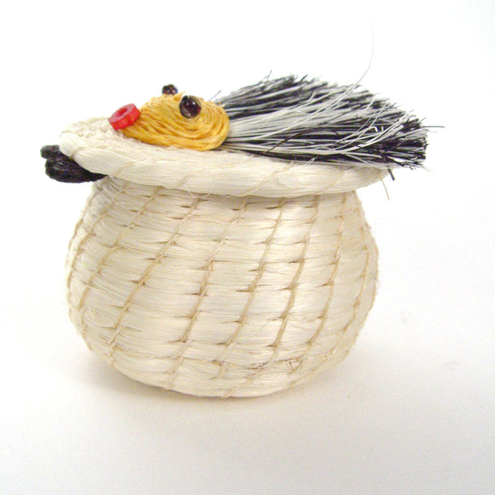 Hedgehog basket, top view: straw basket with curled black bristles, yellow snout, red nose