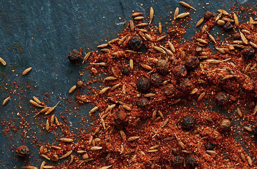 Loose mound of shawarma spice blend with visible herbs and seeds