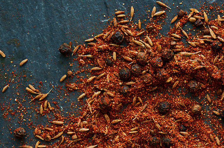 Loose mound of shawarma spice blend with visible herbs and seeds