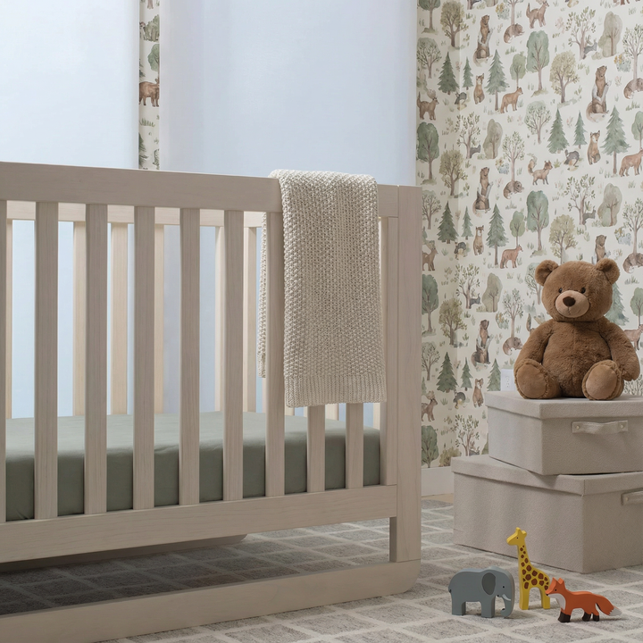 Light off-white crib and toddler fitted sheet with subtle textured finish