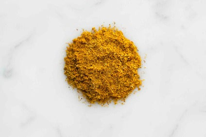 Colombo curry powder pile of finely ground yellow-orange spice